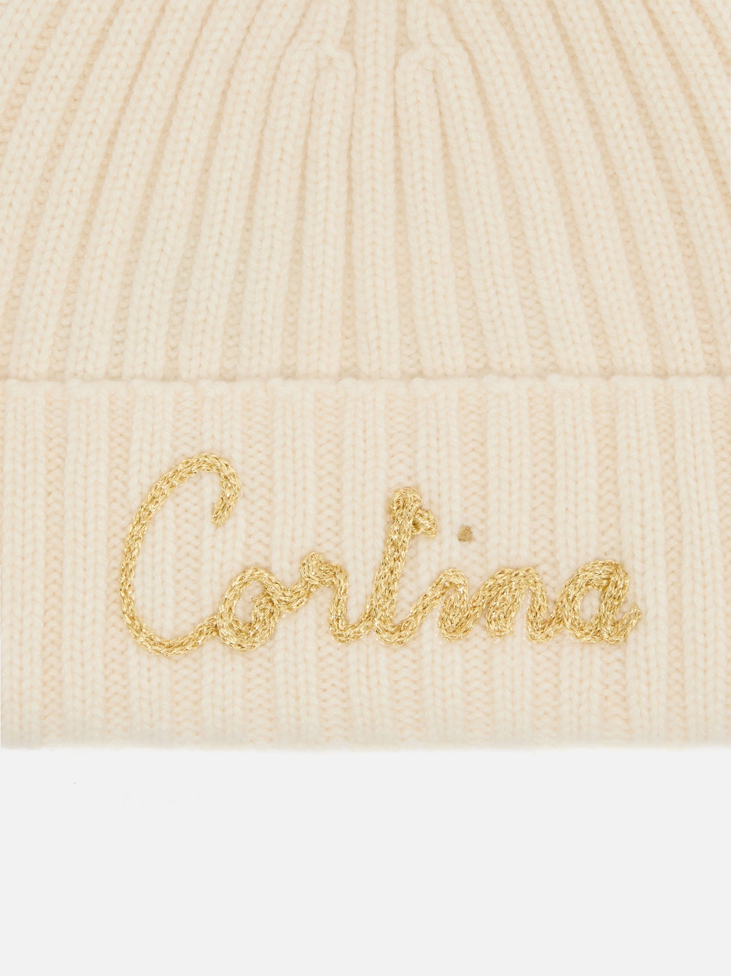 Berretto Wengen in misto cashmere bianco con ricamo lurex Cortinae pompon