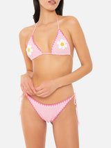 Woman crochet triangle bikini with daisy patch