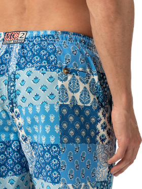 Mid-length swim-shorts Caprese with floral patch print