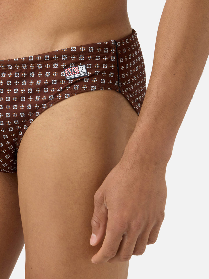 Cayo brown solid swim briefs with geometric print