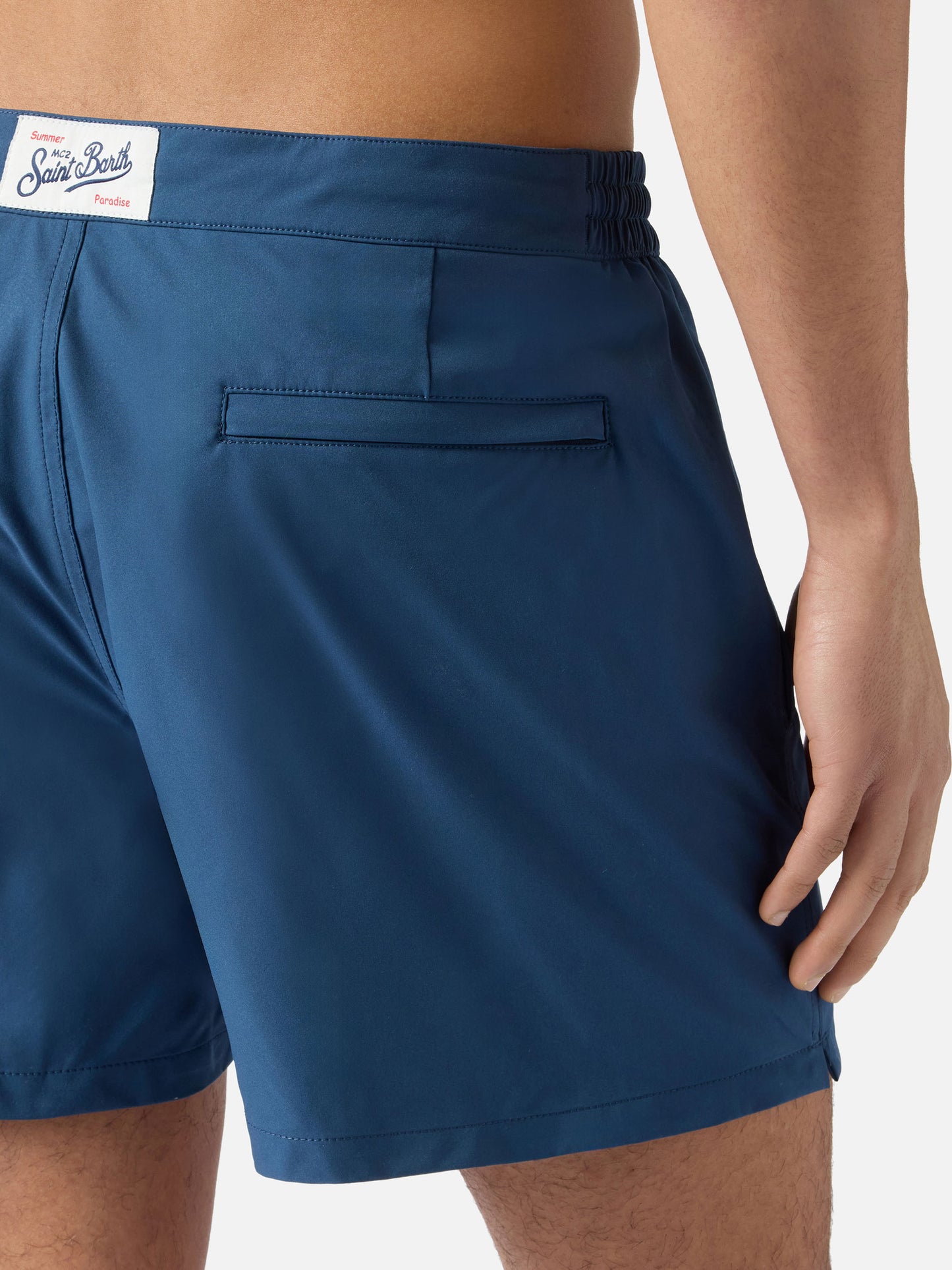 Capferrat swim shorts in solid navy blue with embroidered logo
