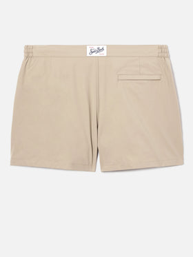 Capferrat swim shorts in solid beige with embroidered logo