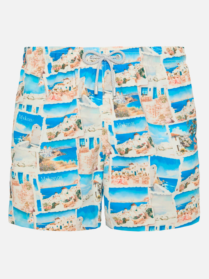 Mid-length Gustavia swim-shorts with Mykonos postcard print | AI CO-CREATED DESIGN BY RICKDICK - POWERED BY RED-EYE