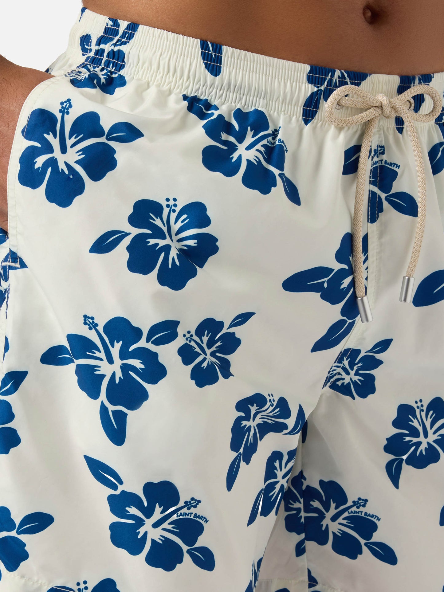 White Lighting swim shorts with all-over hibiscus print