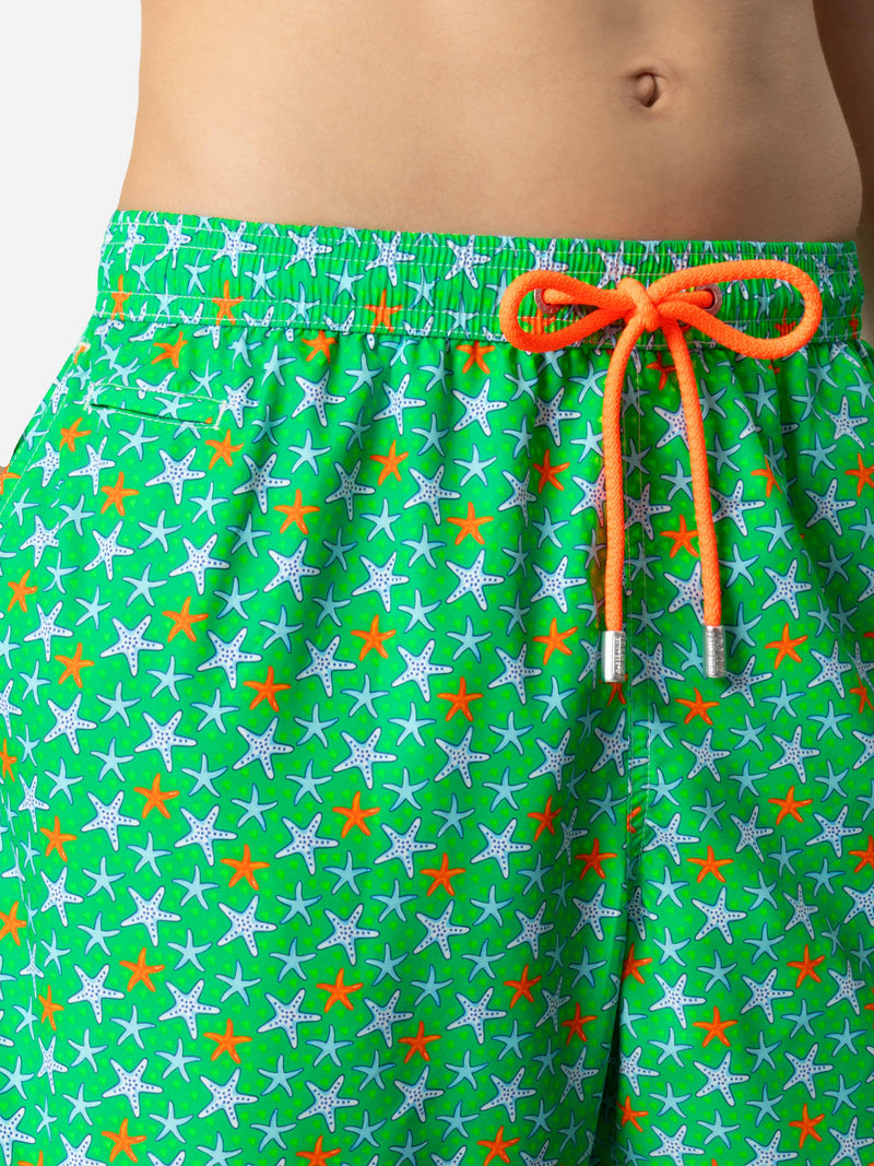 Man light fabric swim shorts with multicolor starfish print