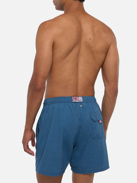 Patmos swim shorts in navy blue with used effect and logo embroidery