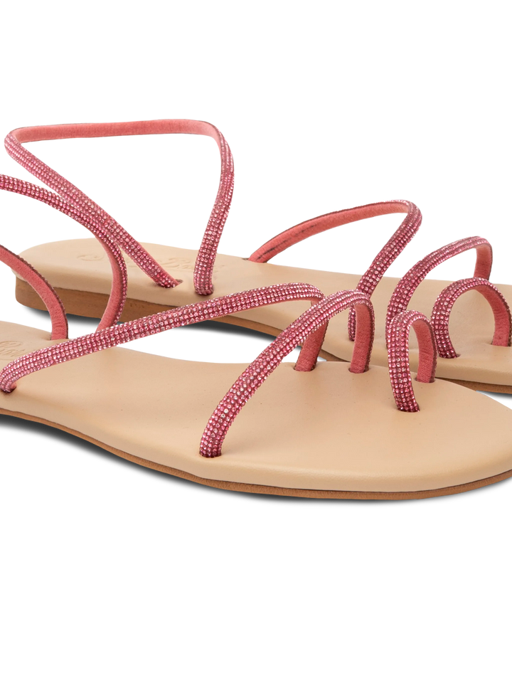Flache Ringsandalen mit pinkfarbenen Strasssteinen