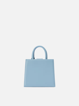Structured Shop mini bag in light blue smooth leather with metal tag