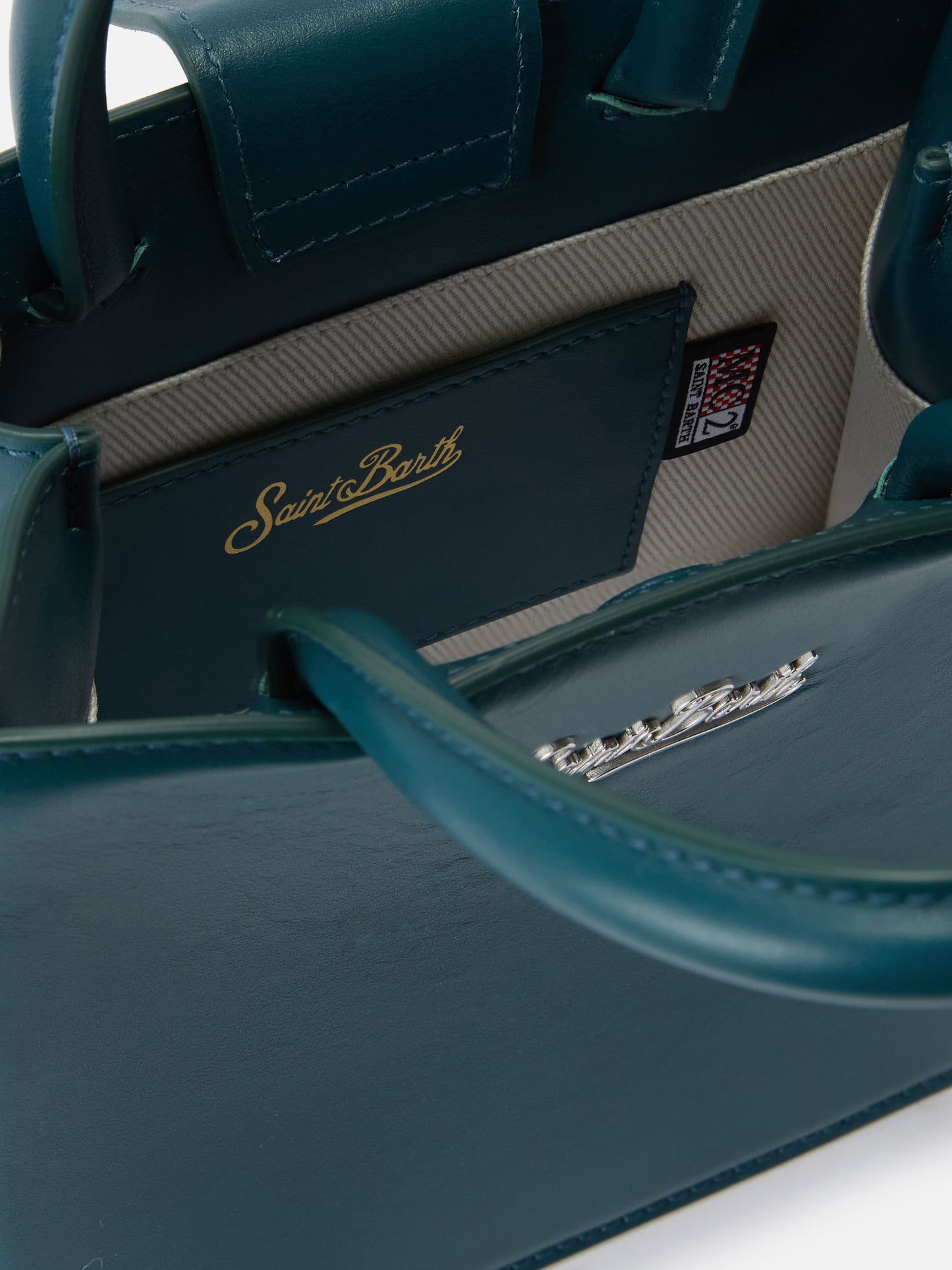 Structured Shop mini bag in teal green smooth leather with metal tag