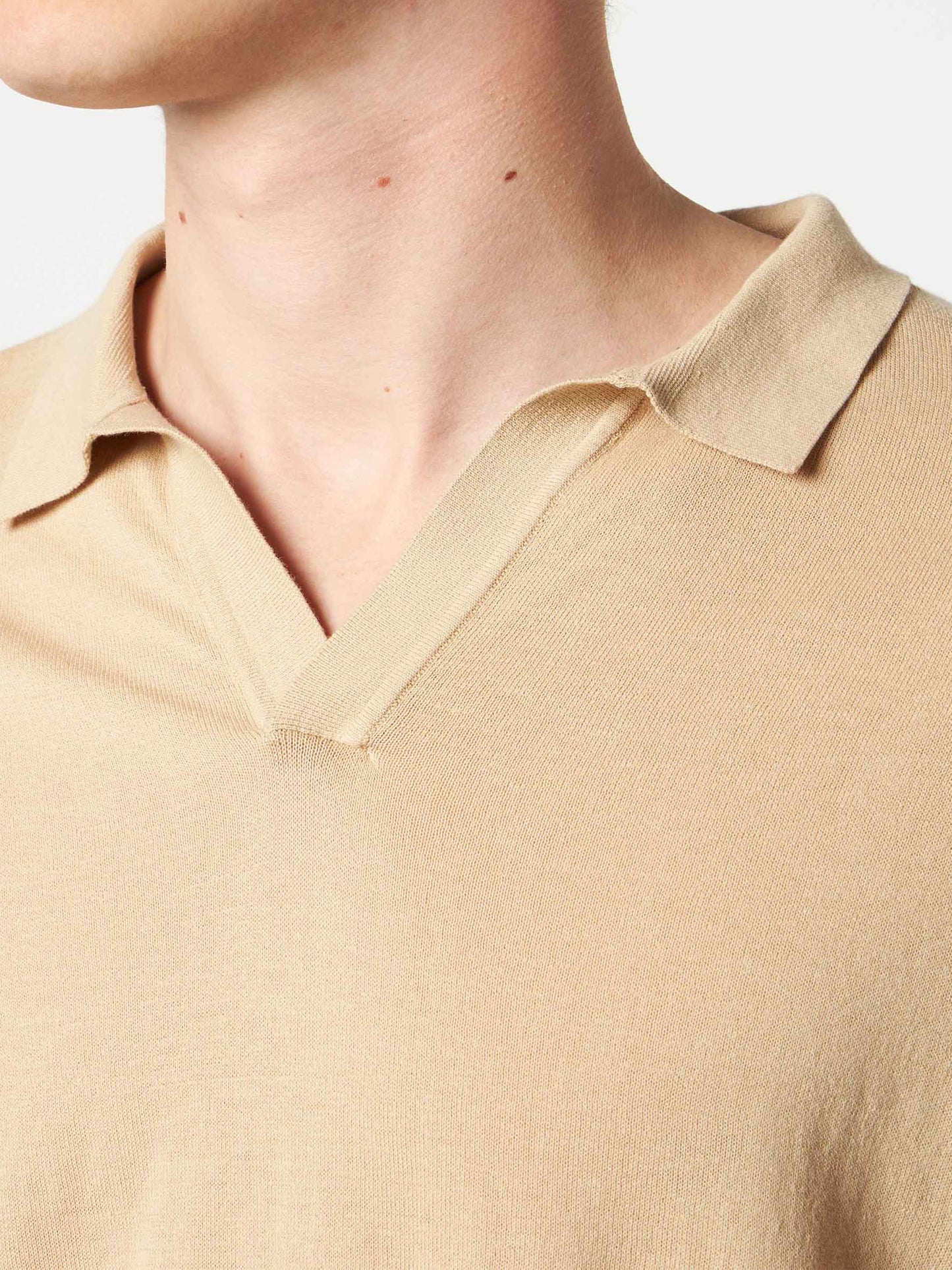 Sloan beige knitted buttonless polo shirt