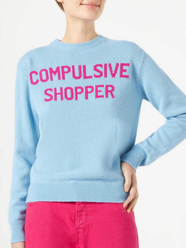 Woman crewneck light blue sweater with Compulsive Shopper jacquard