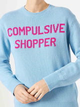 Maglia da donna girocollo di colore azzurro con stampa Compulsive Shopper