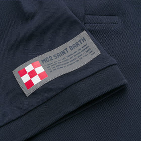 Polo da bambino in piquet con ricamo davanti e stampa dietro